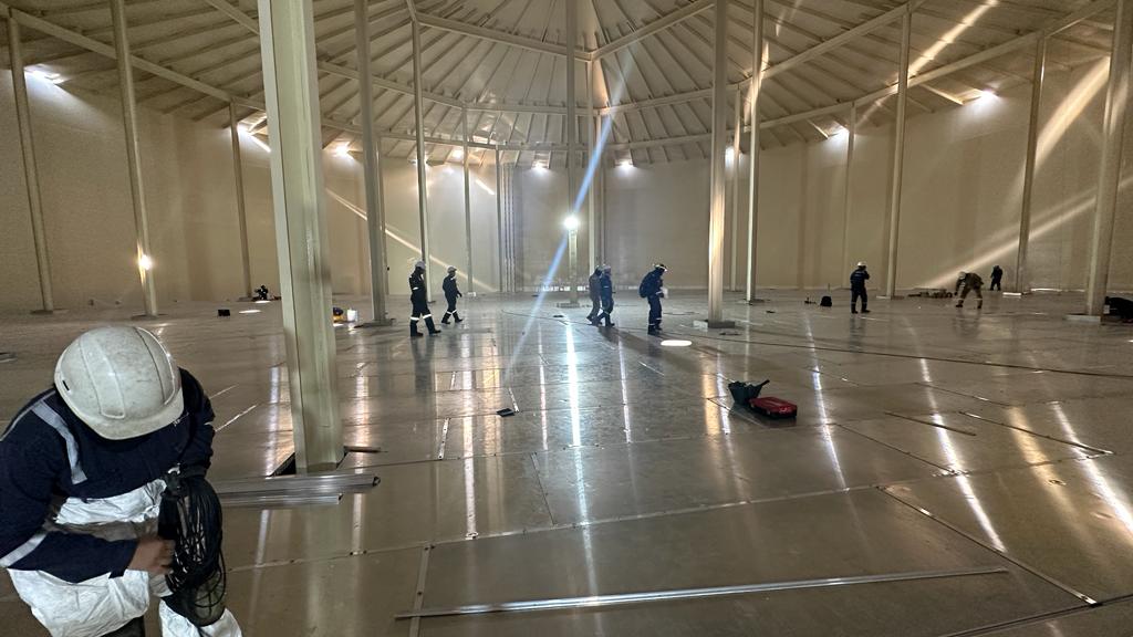 Installation crew working on an internal floating roof